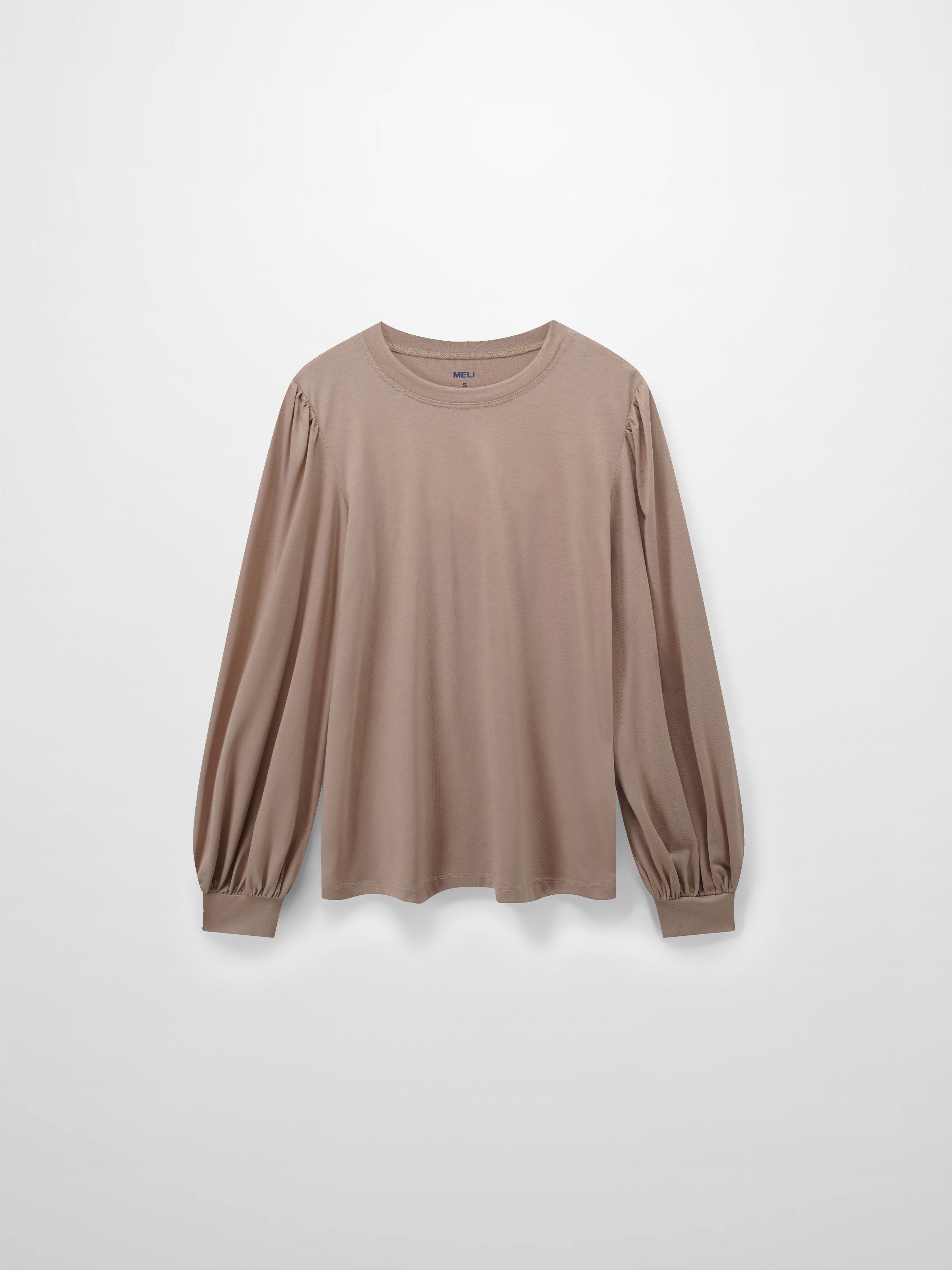 A full, front view of the long-sleeved beige shirt. The design features puffed shoulders and voluminous sleeves that are gathered into wide, fitted cuffs at the wrist.