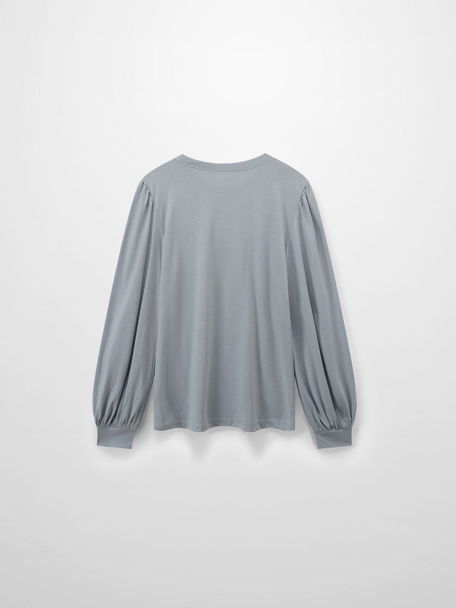 A full, back view of the light gray, long-sleeved shirt. The distinctive puffed shoulders and voluminous, gathered sleeves are also visible from behind.