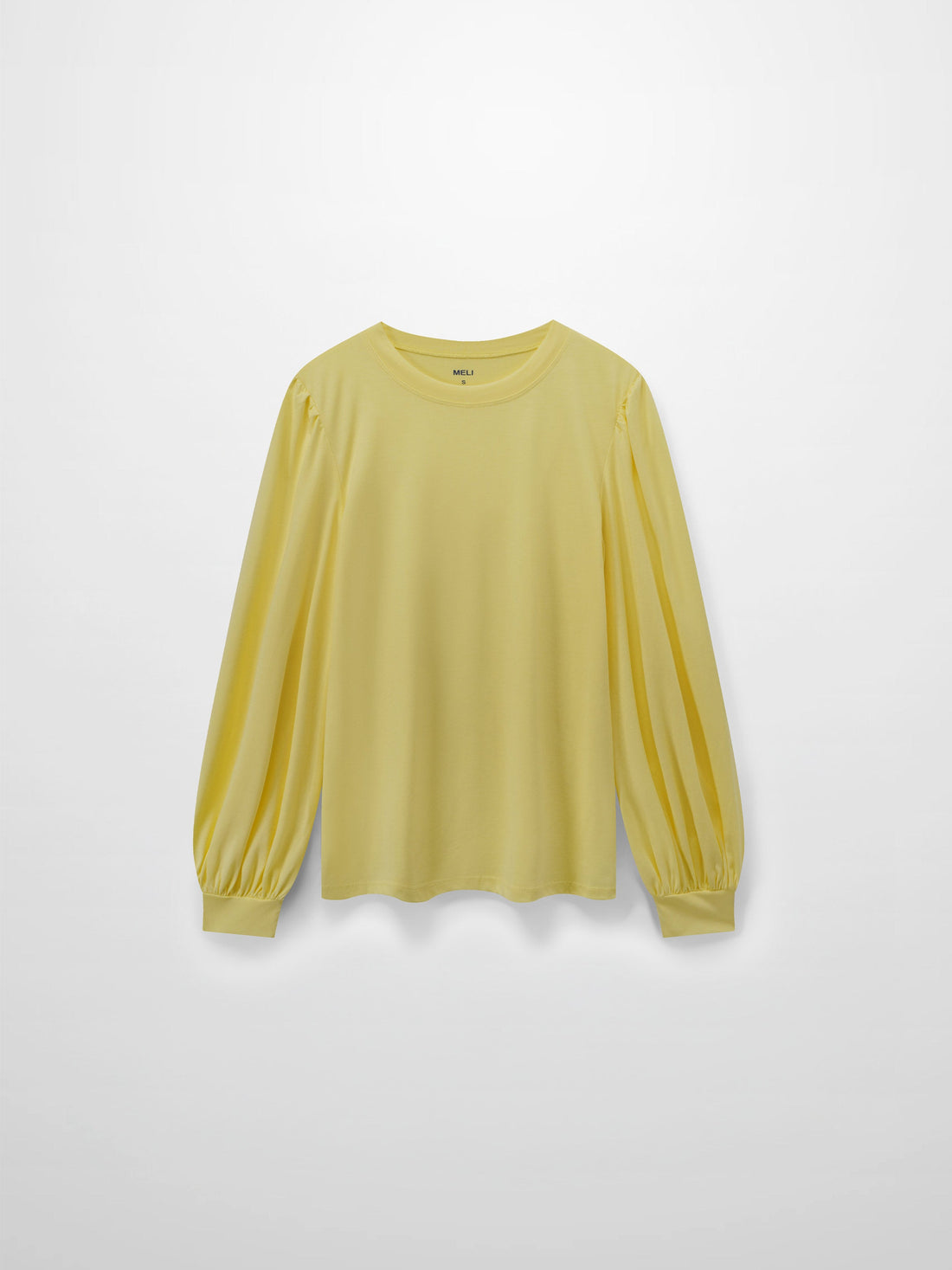 A full, front view of the pale yellow, long-sleeved shirt. It shows the puffed shoulders and voluminous sleeves that gather into fitted cuffs.