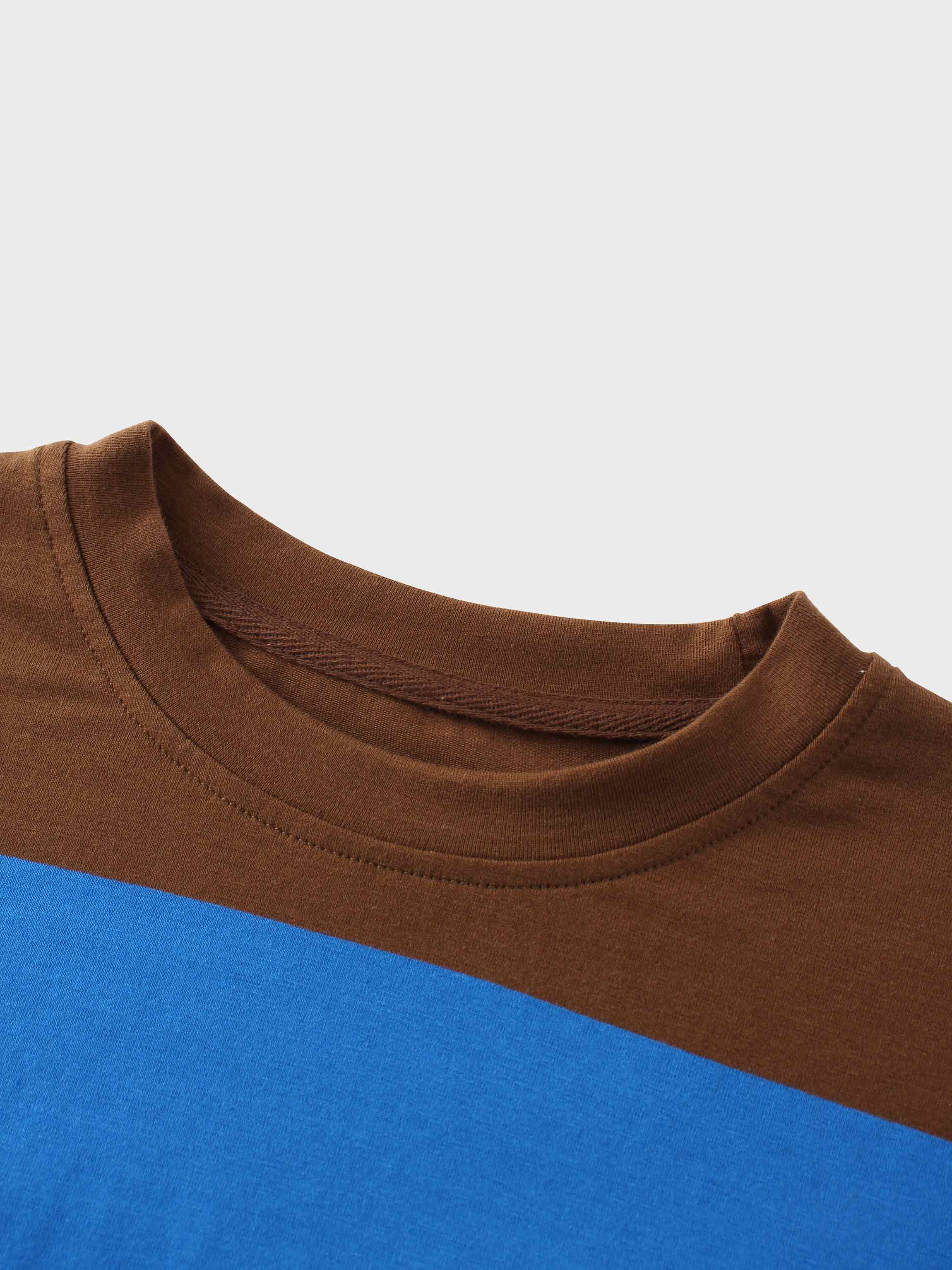 The collar and shoulder area of a brown and blue t-shirt.