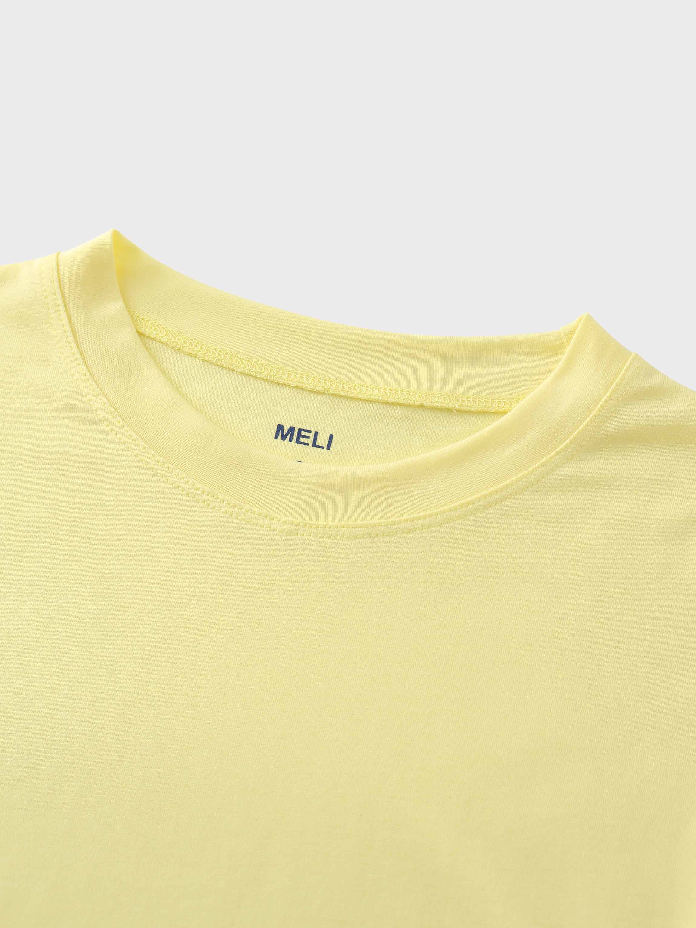 A close-up of the crewneck collar of the pale yellow t-shirt. On the inside, the brand name &quot;MELI&quot; is printed directly onto the fabric in blue.