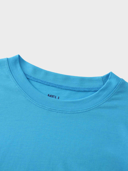 A close-up of the crewneck collar on the bright blue t-shirt. The brand name "MELI" is printed in a darker blue on the inside of the neck.